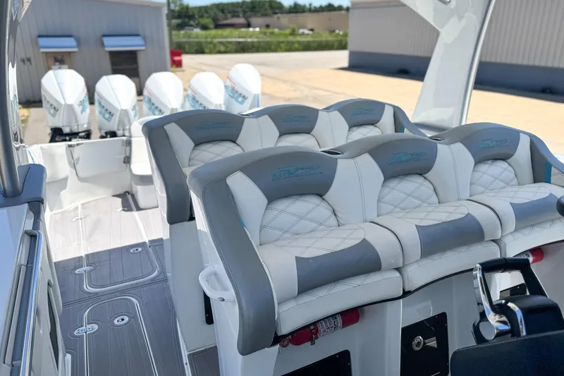 Slide: The Image of Luxury MTI 50 V boat interior with plush seating and multiple outboard engines, 2023 model. - 9