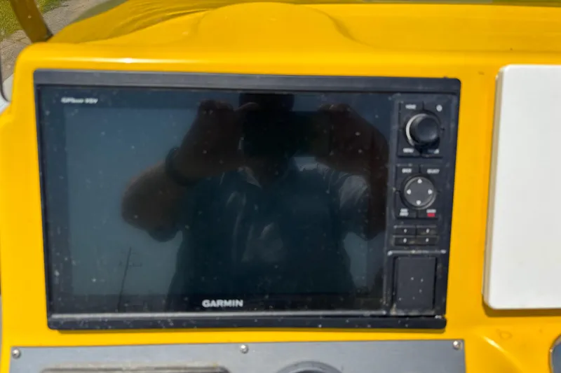 Slide: The Image of Yellow Epic 22 boat dashboard with Garmin GPS device, 2014 model. - 10