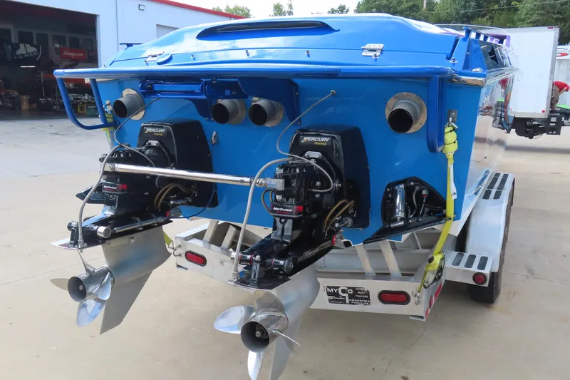 Slide: The Image of 2004 Cigarette 38 Top Gun TS boat with dual Mercury engines on trailer. - 10