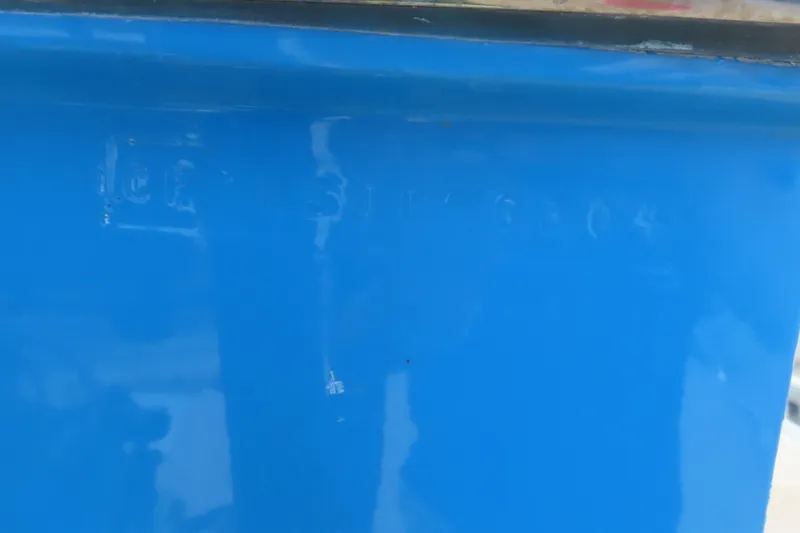 Slide: The Image of Close-up of blue hull with embossed serial number on 2004 Cigarette 38 Top Gun TS. - 12