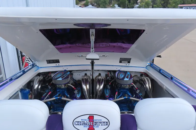 Slide: The Image of 2004 Cigarette 38 Top Gun TS boat engine compartment with dual engines and custom detailing. - 15