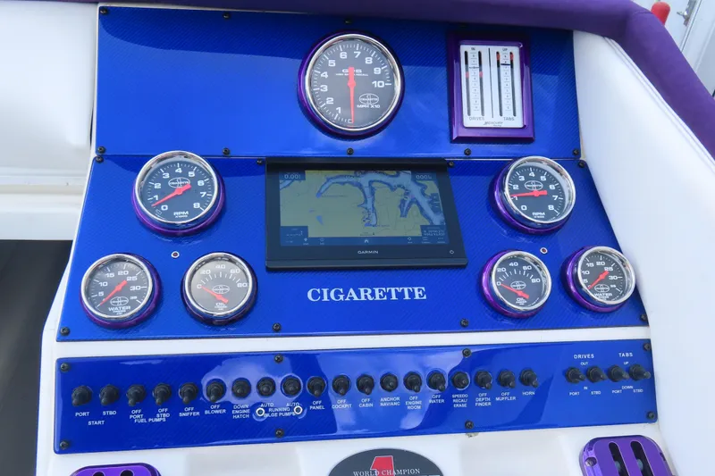 Slide: The Image of Dashboard of 2004 Cigarette 38 Top Gun TS boat with gauges and navigation display. - 17