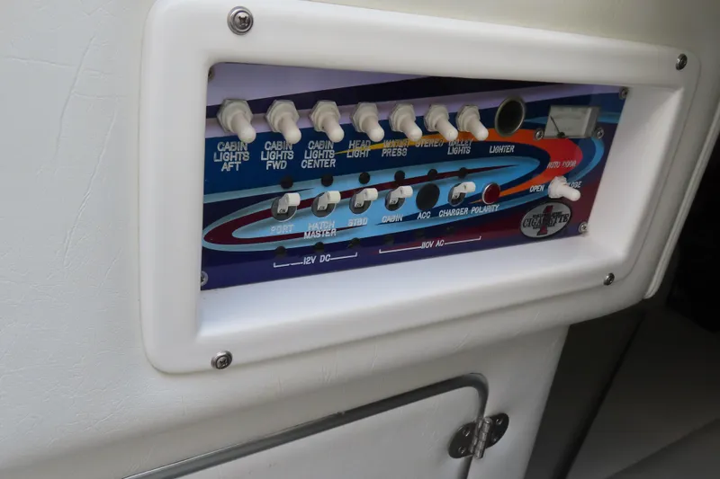 Slide: The Image of Control panel of a 2004 Cigarette 38 Top Gun TS boat with labeled switches. - 18