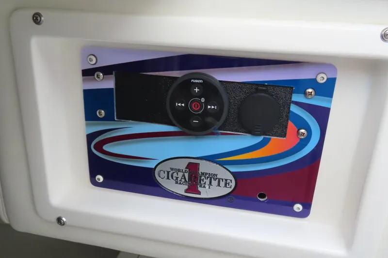Slide: The Image of Control panel of a 2004 Cigarette 38 Top Gun TS boat with colorful design. - 19