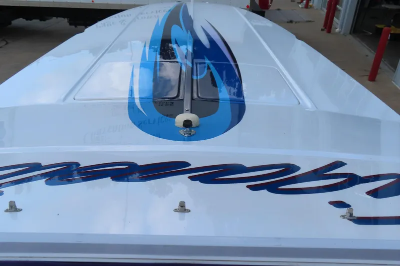 Slide: The Image of 2004 Cigarette 38 Top Gun TS boat with blue flame design on deck. - 20