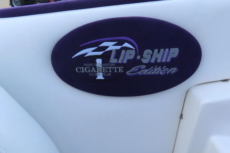 Slide: The Image of 2004 Cigarette 38 Top Gun TS Lip-Ship Edition logo on boat interior. - 21