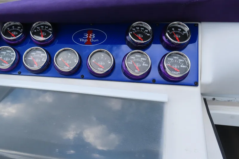 Slide: The Image of Dashboard of 2004 Cigarette 38 Top Gun TS with gauges and controls. - 27