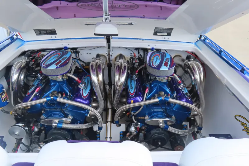 Slide: The Image of 2004 Cigarette 38 Top Gun TS boat engine compartment with dual high-performance engines. - 3