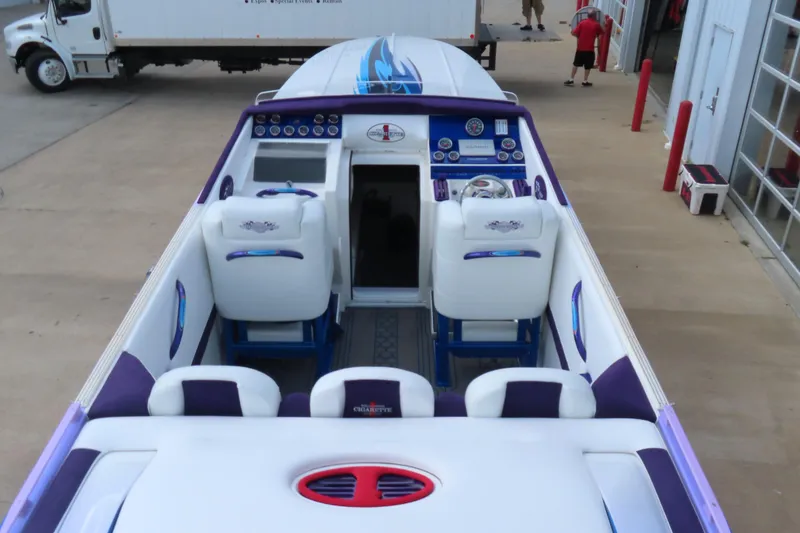 Slide: The Image of 2004 Cigarette 38 Top Gun TS boat interior with white and purple seating. - 4