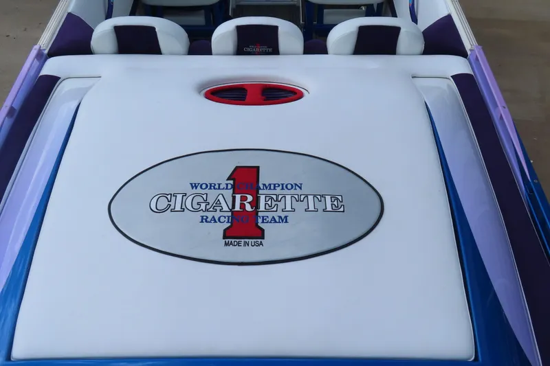 Slide: The Image of 2004 Cigarette 38 Top Gun TS boat with racing team logo on deck. - 8