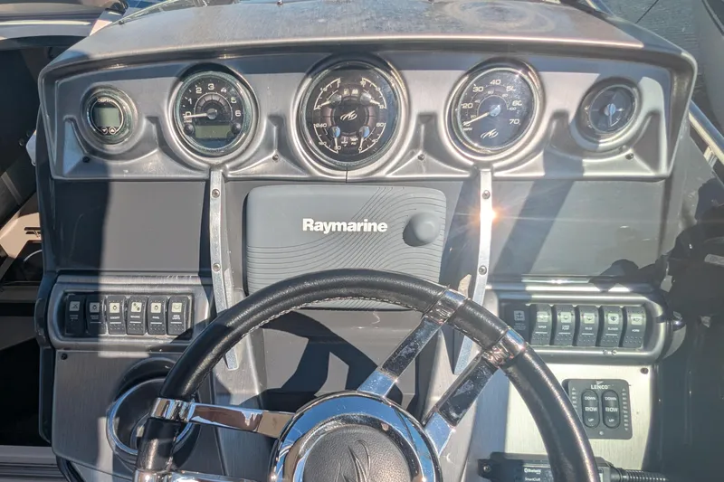 Slide: The Image of Dashboard of a 2013 Monterey 280 Sport Yacht with Raymarine navigation system. - 19