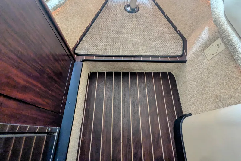 Slide: The Image of Interior view of 2013 Monterey 280 Sport Yacht with wood and carpet flooring. - 32