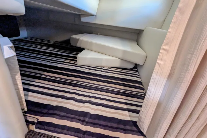 Slide: The Image of Interior cabin of 2013 Monterey 280 Sport Yacht with striped flooring and cushions. - 33