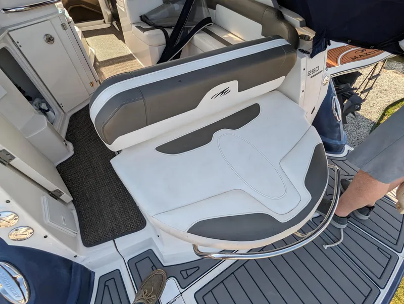 Slide: The Image of 2013 Monterey 280 Sport Yacht seating area with gray and white upholstery. - 7