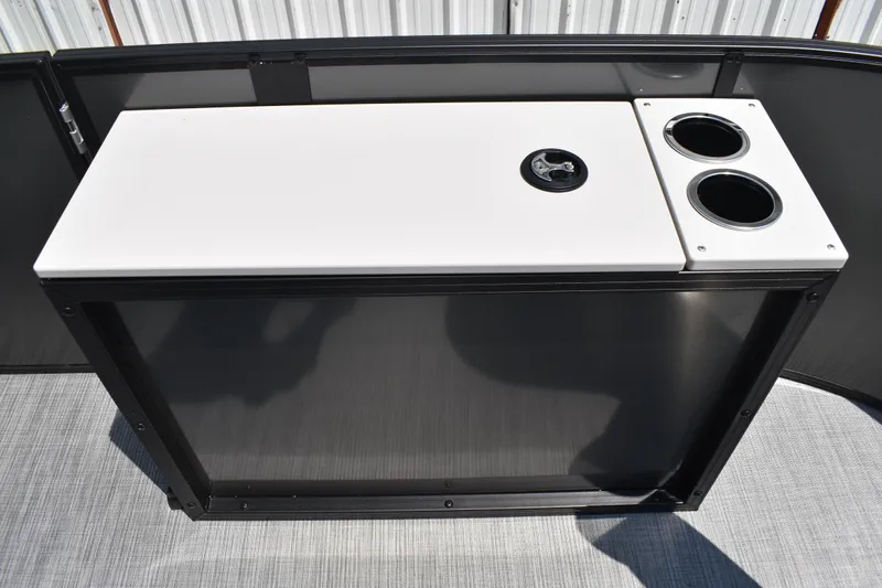 Slide: The Image of 2026 Lowe SF 212 WT Sport Fish boat console with cup holders and storage compartment. - 19