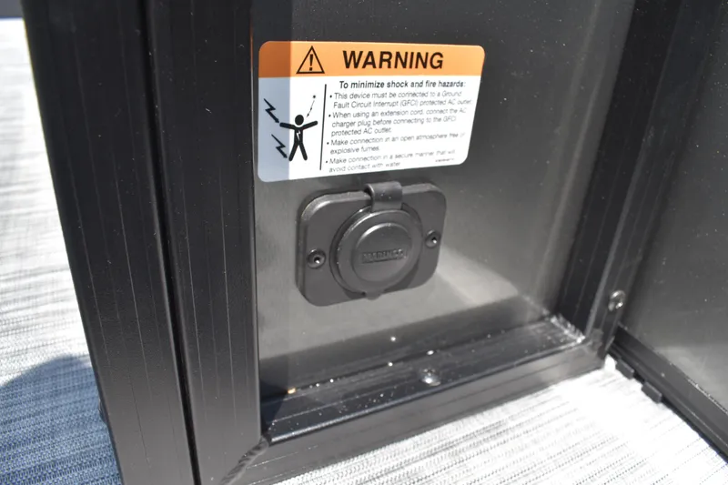 Slide: The Image of Warning label and outlet on 2026 Lowe SF 212 WT Sport Fish boat. - 21