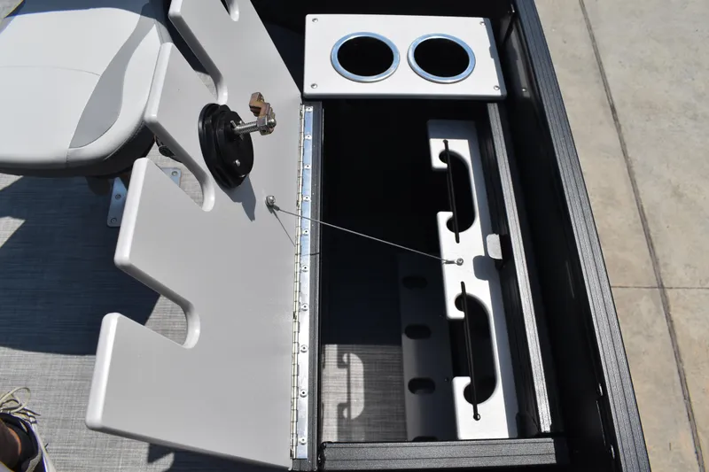 Slide: The Image of 2026 Lowe SF 212 WT Sport Fish boat storage compartment with cup holders and seating. - 24