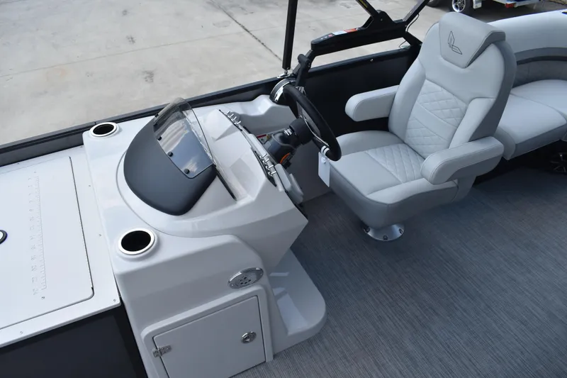 Slide: The Image of 2026 Lowe SF 212 WT Sport Fish boat interior with steering console and captain's chair. - 29