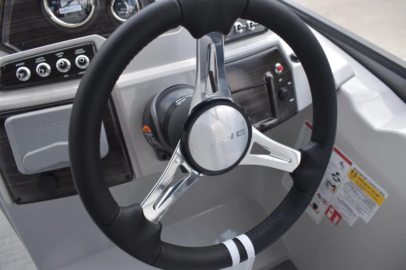 Slide: The Image of Steering wheel of 2026 Lowe SF 212 WT Sport Fish boat with control panel. - 35