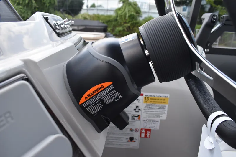 Slide: The Image of Steering wheel and warning label on 2026 Lowe SF 212 WT Sport Fish boat. - 36
