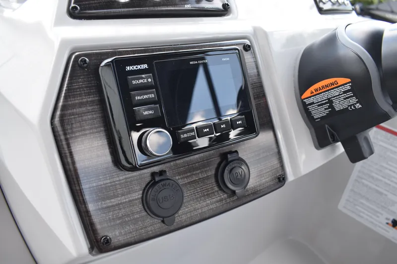Slide: The Image of 2026 Lowe SF 212 WT Sport Fish dashboard with Kicker media center and USB ports. - 37