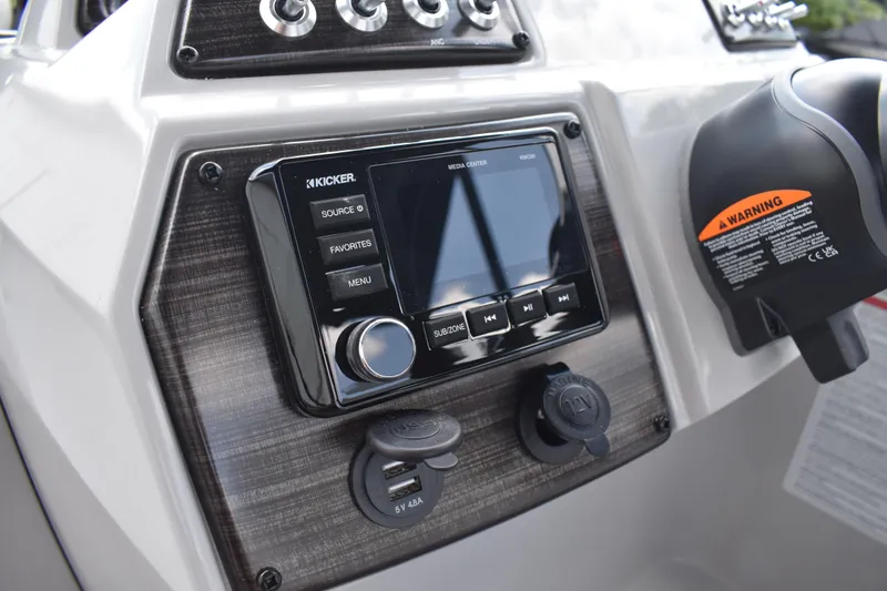 Slide: The Image of 2026 Lowe SF 212 WT Sport Fish dashboard with Kicker media center and USB ports. - 38