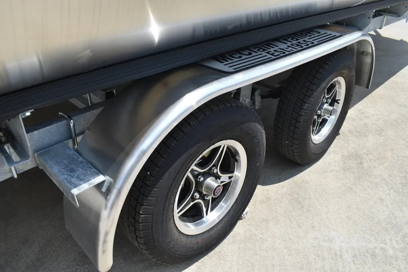 Slide: The Image of Trailer wheels of 2026 Lowe SF 212 WT Sport Fish boat on concrete surface. - 4