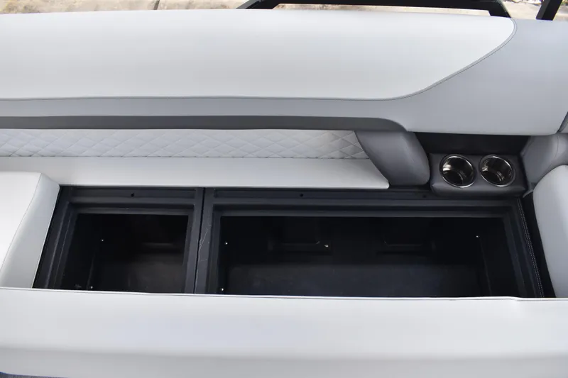 Slide: The Image of 2026 Lowe SF 212 WT Sport Fish boat interior with storage compartments and cup holders. - 46