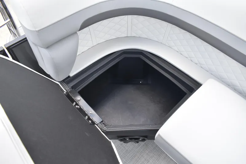 Slide: The Image of 2026 Lowe SF 212 WT Sport Fish boat storage compartment with cushioned seating. - 47