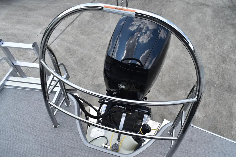 Slide: The Image of 2026 Lowe SF 212 WT Sport Fish boat engine with chrome railing and reflection. - 50