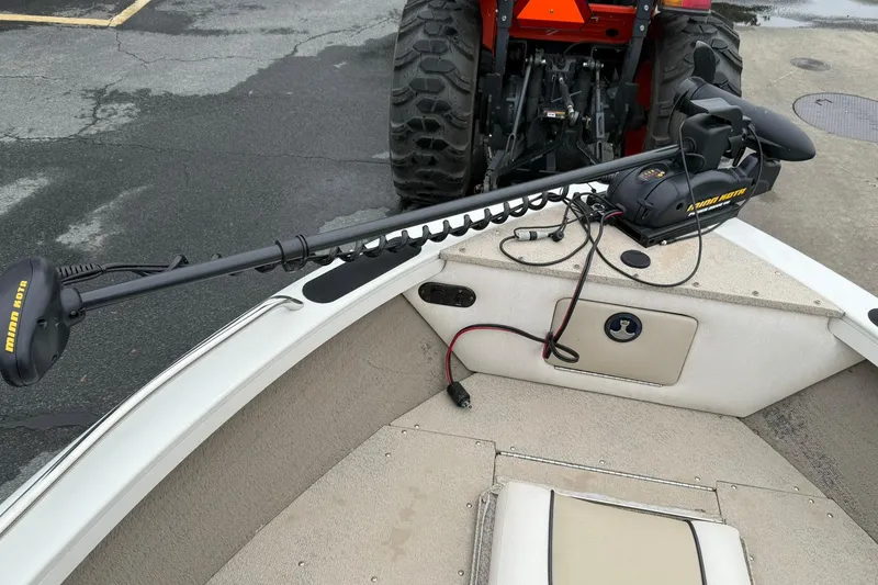 Slide: The Image of 2014 Crestliner 1850 Sportfish boat with Minn Kota trolling motor on deck. - 11