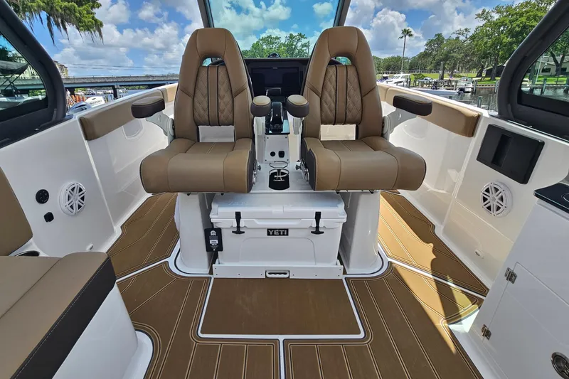 Slide: The Image of 2026 Monterey Elite 25 OB boat interior with luxurious seating and modern design. - 11
