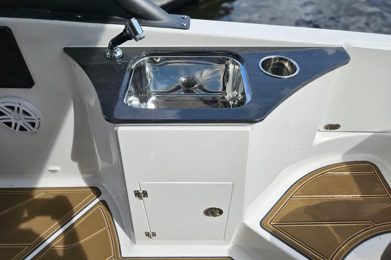 Slide: The Image of Luxury sink area on 2026 Monterey Elite 25 OB boat, featuring sleek design and modern amenities. - 15