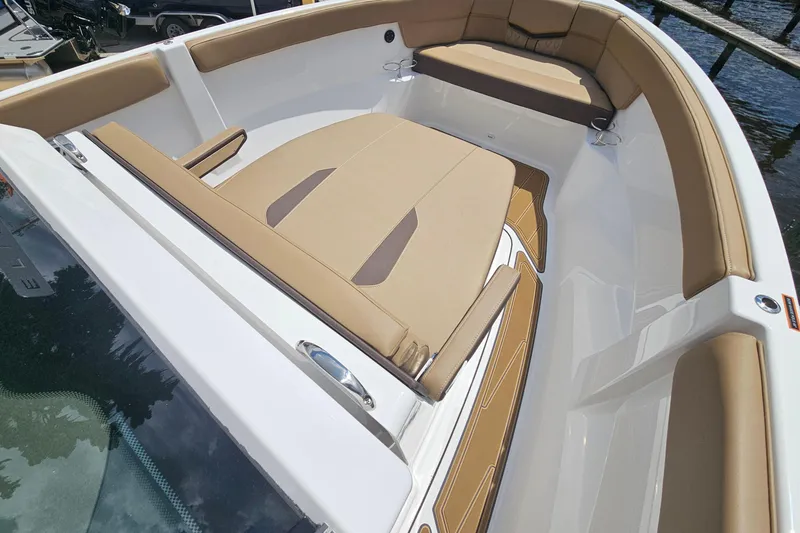 Slide: The Image of 2026 Monterey Elite 25 OB boat with tan seating and sleek design. - 18
