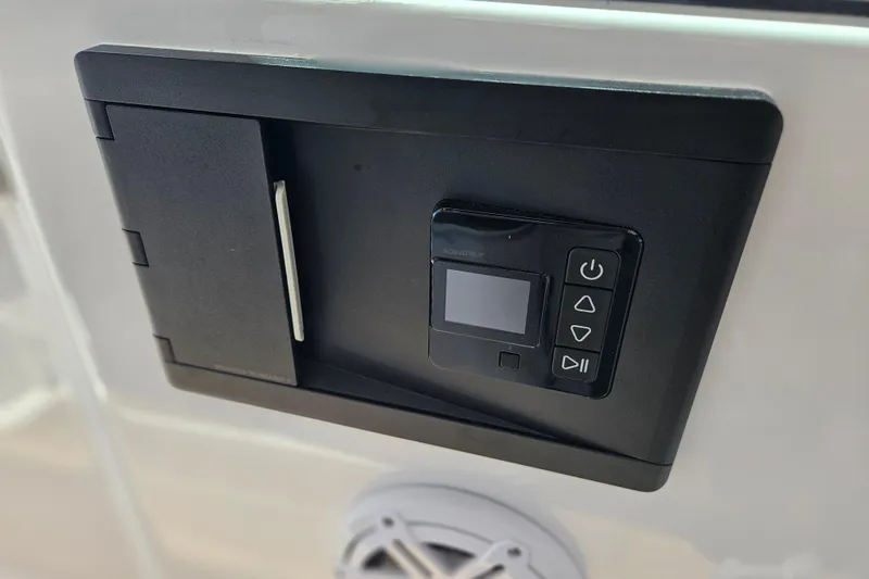 Slide: The Image of Control panel on 2026 Monterey Elite 25 OB boat, featuring digital display and buttons. - 24