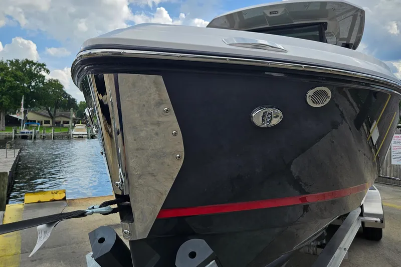 Slide: The Image of 2026 Monterey Elite 25 OB boat docked, showcasing sleek design and modern features. - 36