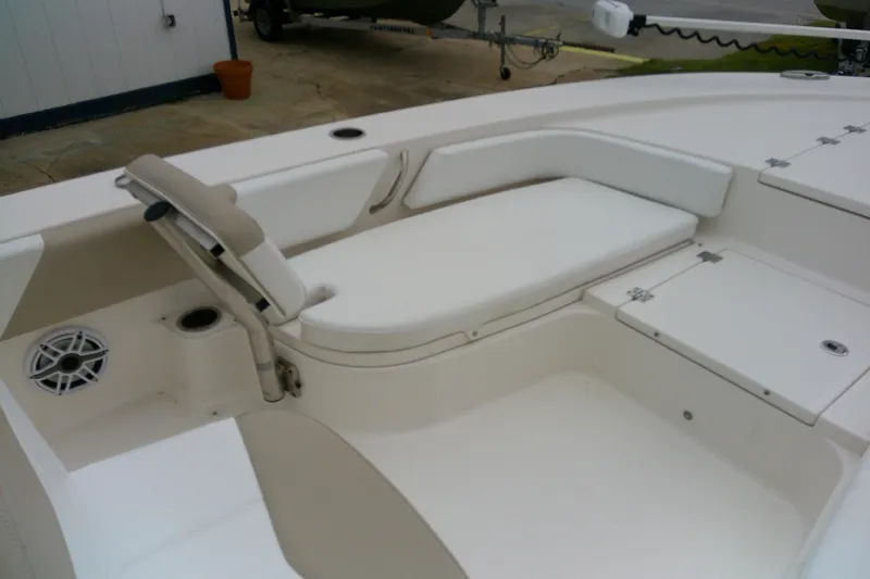 Slide: The Image of 2021 Robalo 246 Cayman boat interior with seating and storage compartments. - 12