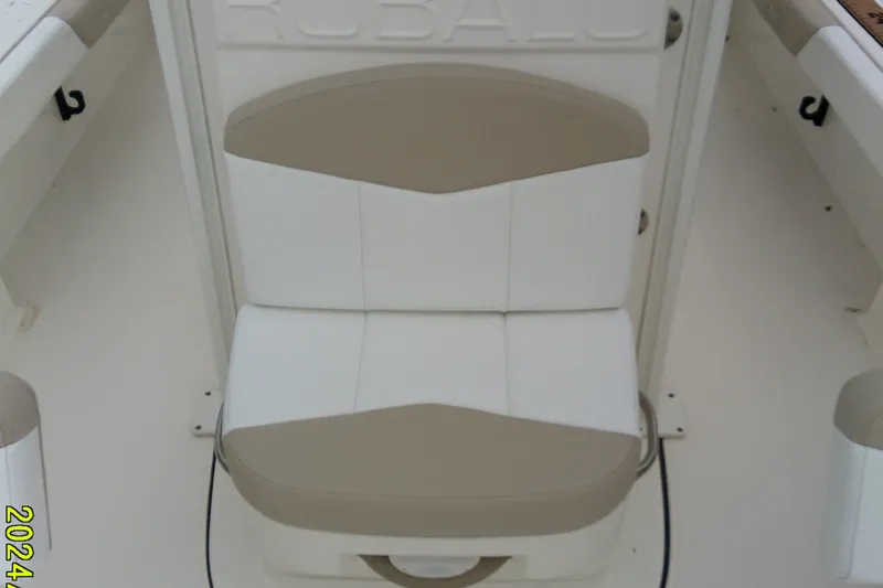 Slide: The Image of 2021 Robalo 246 Cayman boat seat with beige and white upholstery. - 19