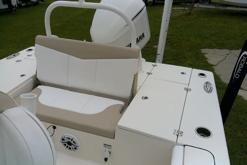 Slide: The Image of 2021 Robalo 246 Cayman boat interior with seating and storage compartments. - 25