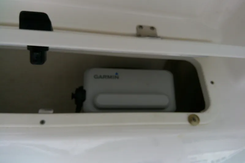Slide: The Image of Storage compartment on 2021 Robalo 246 Cayman boat with Garmin device inside. - 30