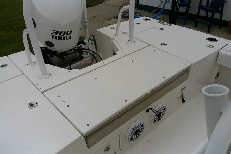 Slide: The Image of 2021 Robalo 246 Cayman boat with Yamaha 300 engine, featuring deck and speakers. - 34