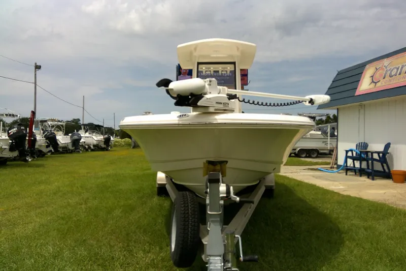 Slide: The Image of 2021 Robalo 246 Cayman boat on trailer, parked on grass near dealership. - 38