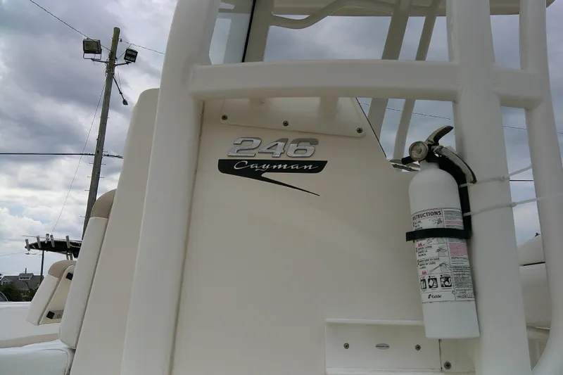 Slide: The Image of 2021 Robalo 246 Cayman boat with fire extinguisher, cloudy sky background. - 4