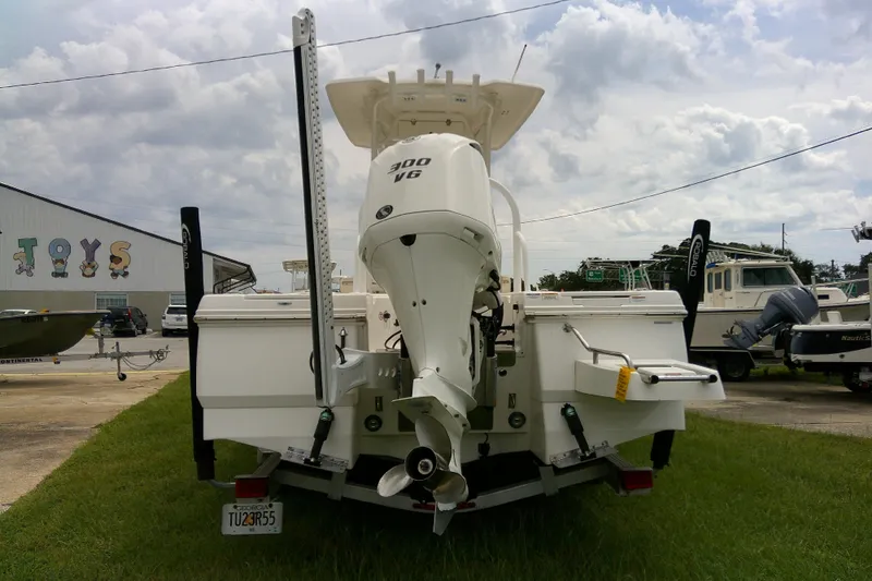 Slide: The Image of 2021 Robalo 246 Cayman boat with powerful 300 V6 engine, parked outdoors. - 41