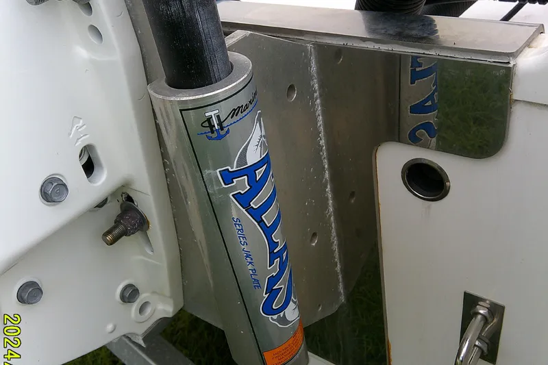 Slide: The Image of Close-up of a 2021 Robalo 246 Cayman boat's Atlas jack plate mechanism. - 6