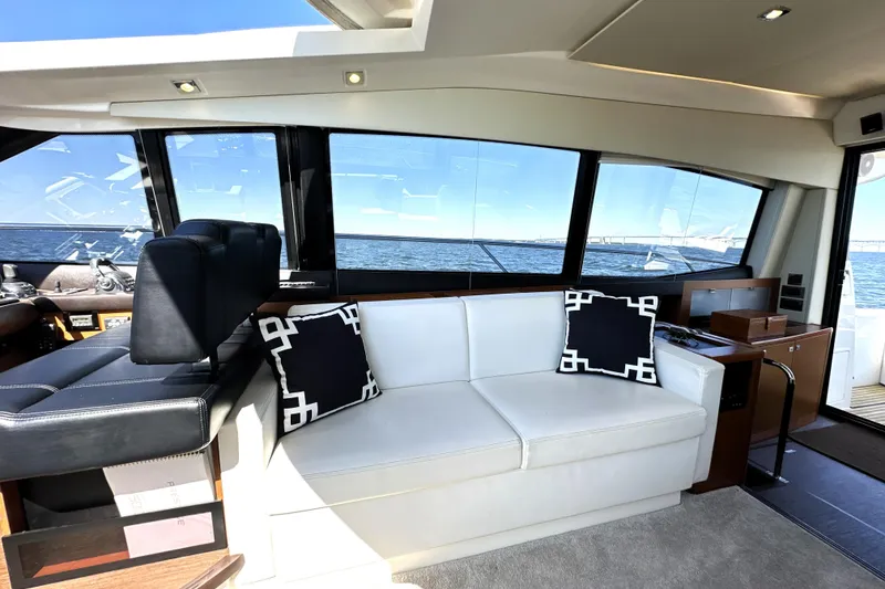 Slide: The Image of Luxurious interior of 2016 Prestige 500 S yacht with white sofa and sea view. - 20
