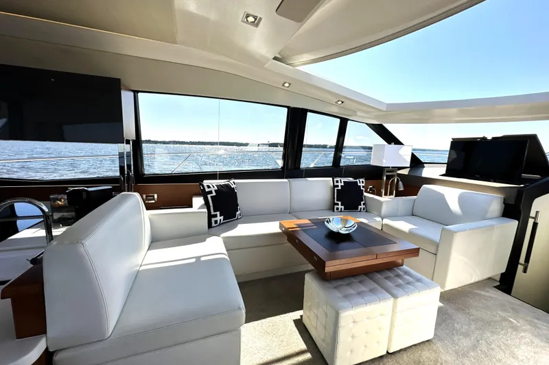 Slide: The Image of Luxurious interior of a 2016 Prestige 500 S yacht with elegant seating and panoramic windows. - 21
