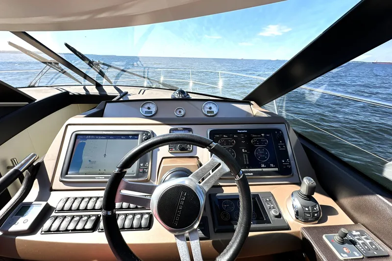 Slide: The Image of Cockpit view of 2016 Prestige 500 S yacht with navigation screens and steering wheel. - 25