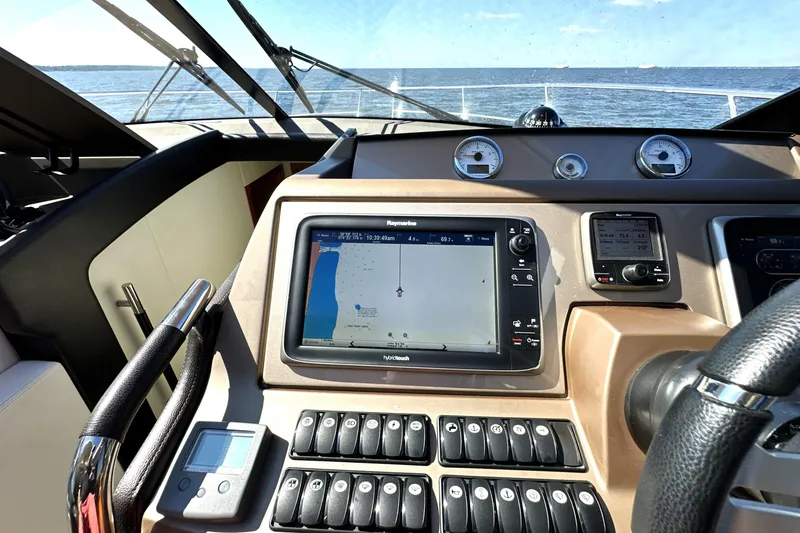 Slide: The Image of Cockpit view of 2016 Prestige 500 S yacht with navigation system and ocean backdrop. - 27