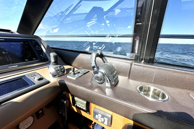 Slide: The Image of Interior of 2016 Prestige 500 S yacht cockpit with navigation controls and ocean view. - 28